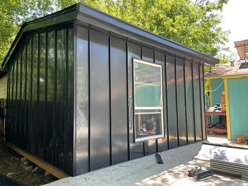 Black standing seam metal wall panels for Roof Inspection in Havelock